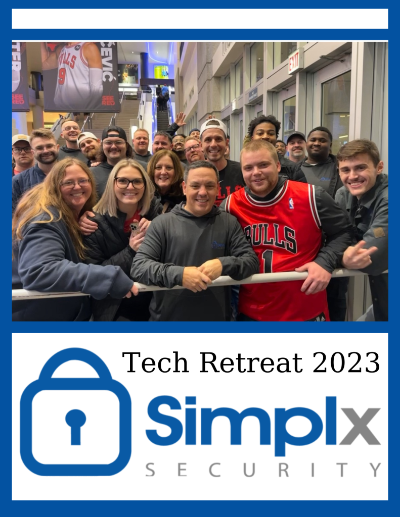 The 2023 Simplx Security Tech Retreat was a blast! Everyone who participated poses next to the rail at the Chicago Bulls game.
