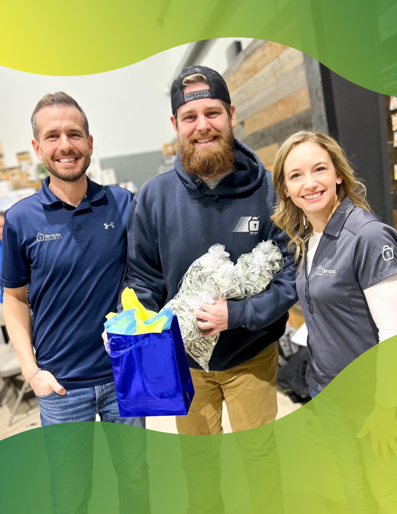 Simplx Security owners Nate & Tara Routsong say a few words during our monthly summit to honor Q (lead tech for business security systems) for his many years of service with us.